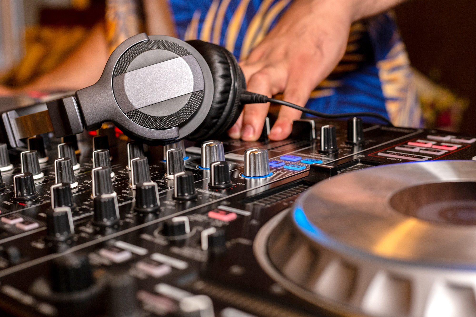 Headphones on DJ console deck. Professional headset